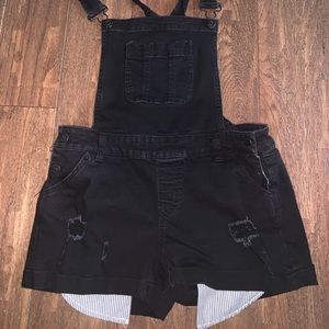 black overalls with striped pockets